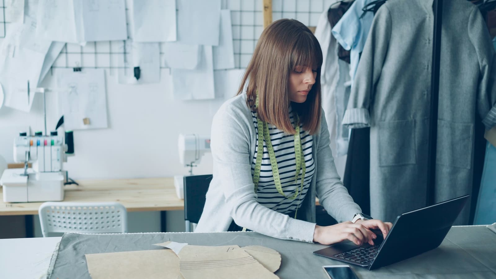 Small business owner working at a laptop in her studio