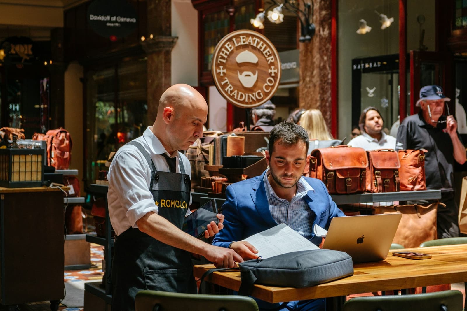 Small business owners reviewing documents in a shop